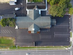 Drone view of empty parking lot showcasing Maitland Parking Lot Striping